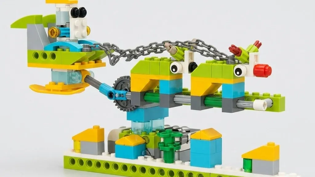Новогодняя модель «Летающий Санта» из деталей, совместимых с WeDo 2.0: сани с Сантой на голубом рычаге поднялись над двумя оленями и рядом домиков с жёлтыми крышами