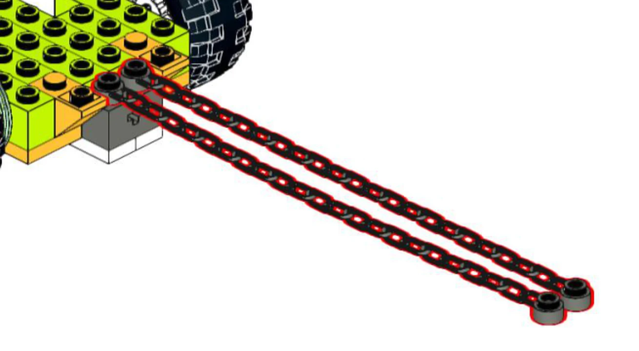 Задняя часть рамы трактора из WeDo 2.0: две цепи надеты кольцами на штифты в корме, свободные концы с кольцами лежат рядом